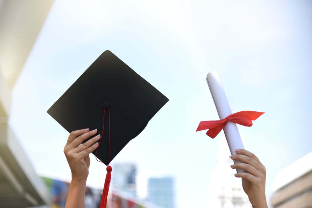 A graduate is proud of earning their AHIP certificate.