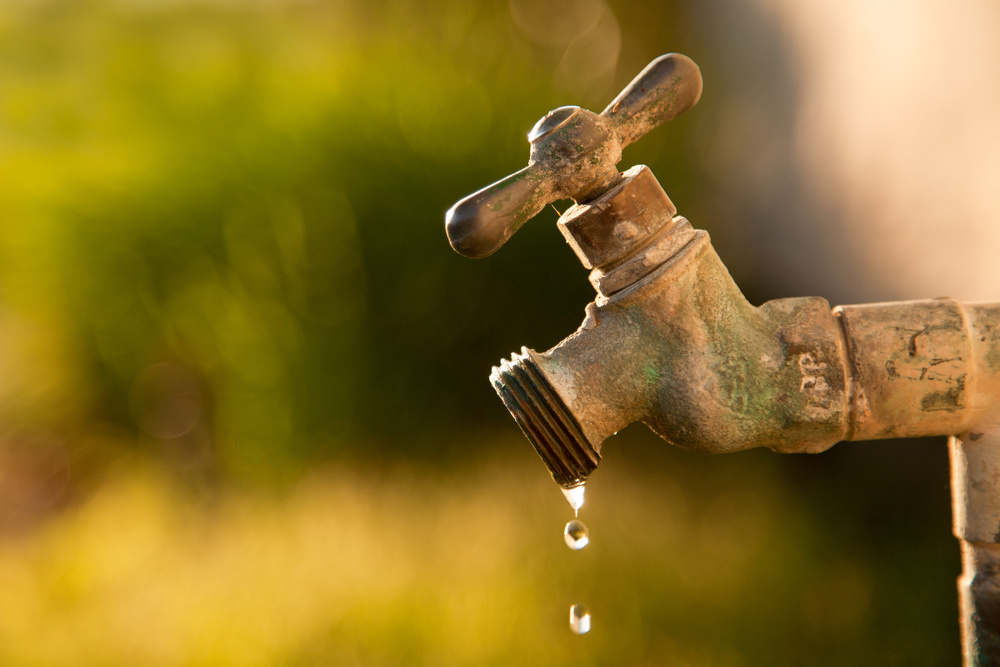 An exterior faucet is dripping slowly, just as drip campaigns provide information to prospects.