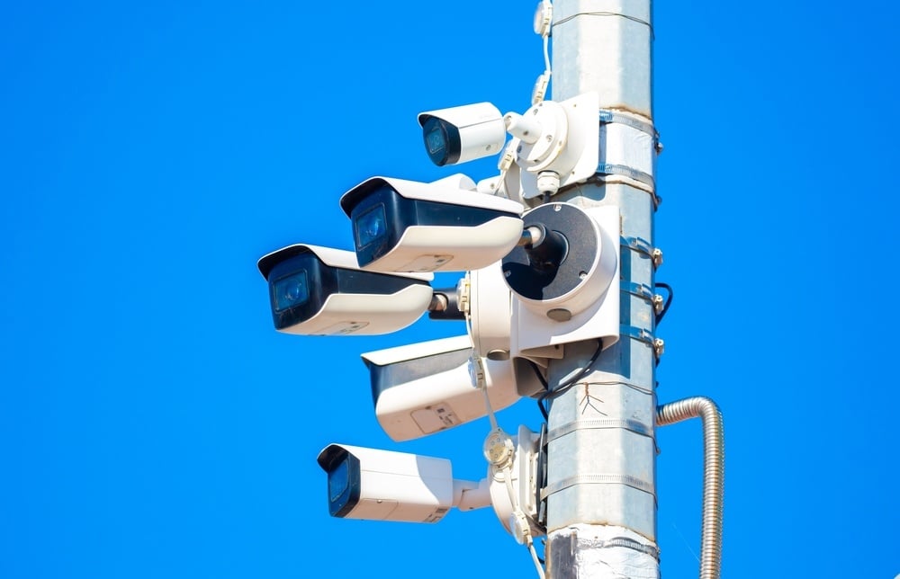 CCTV cameras providing oversight of public behavior.