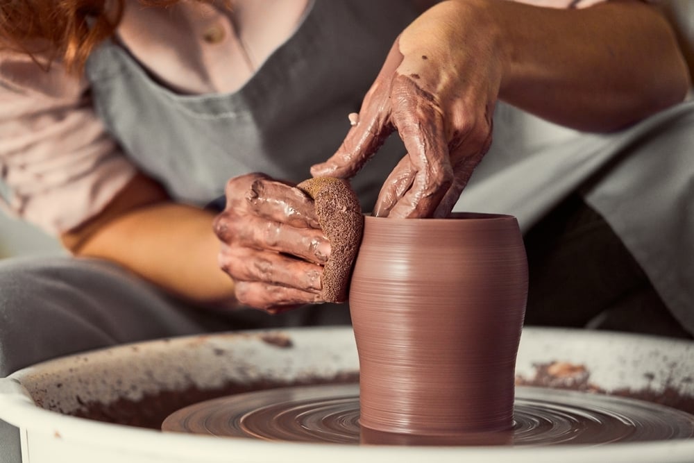 A potter uses tools to reshape a clay vase, just as CMS uses regulations to reshape the Marketplace in 2027.
